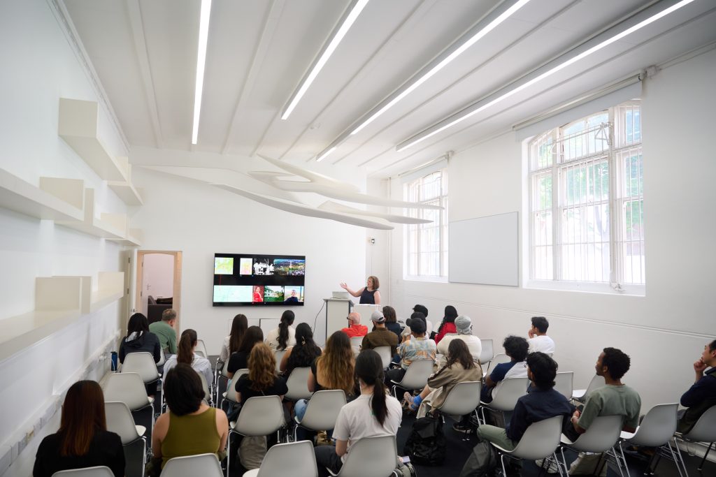 Image of students watching a presentation in a classroom.